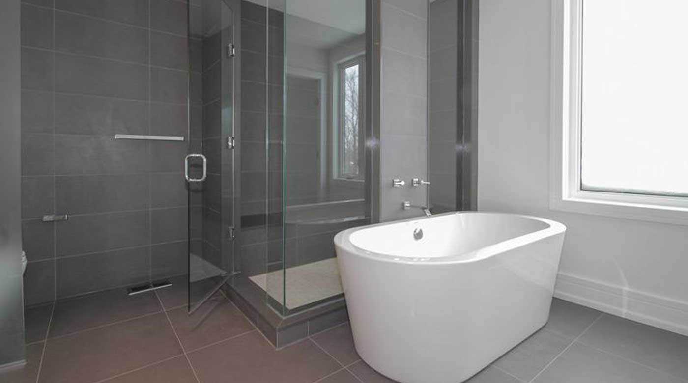 A picture of a bathroom with a shower glass