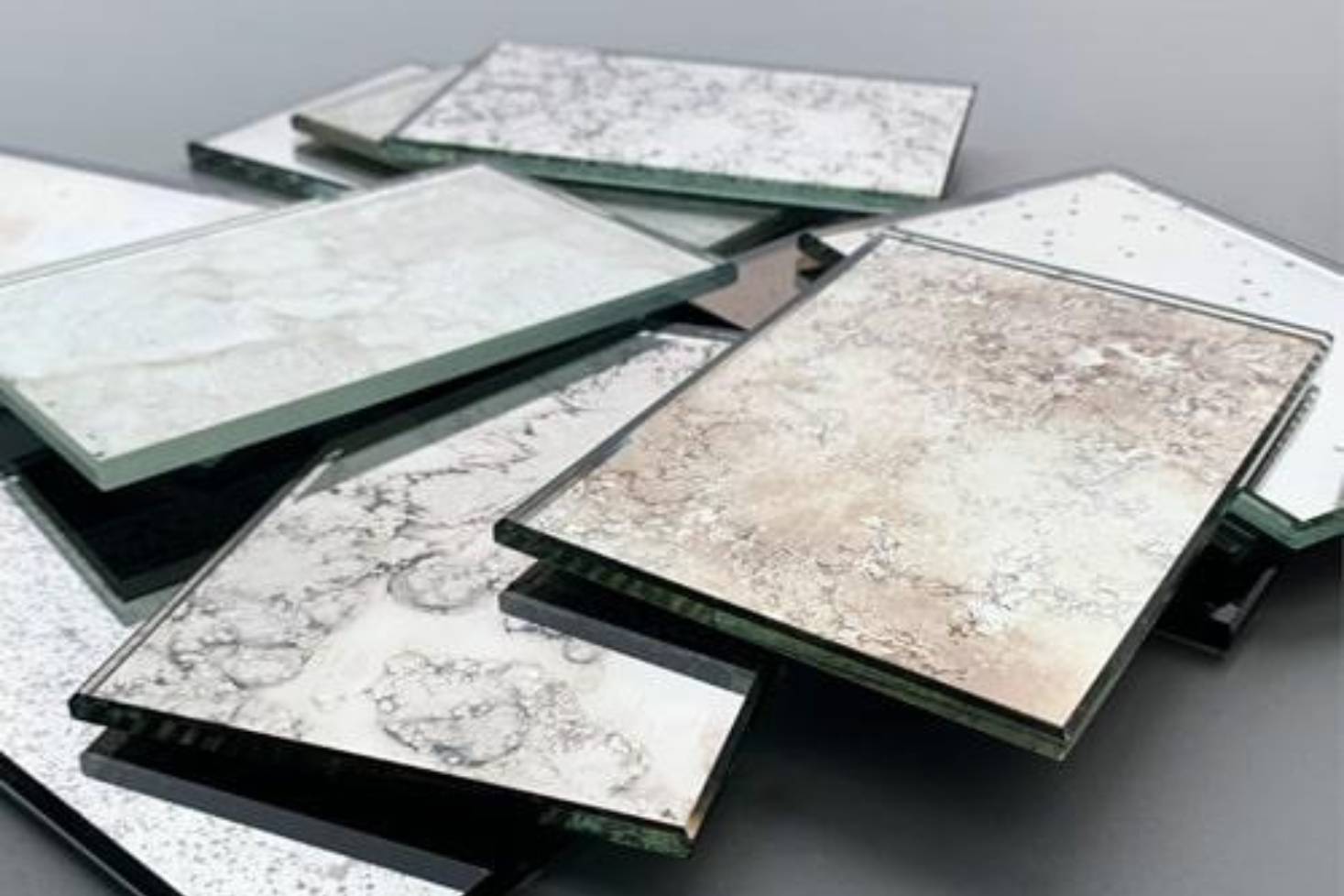 Antique mirror glass samples showing reflective textures.