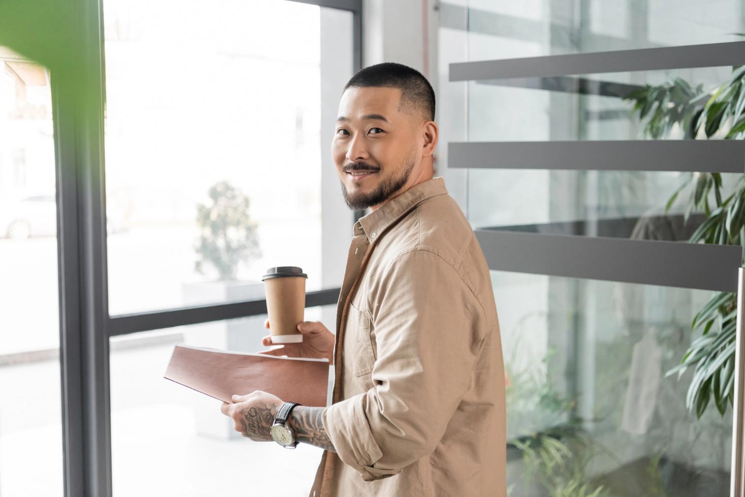 Man in an office with tempered glass partitions